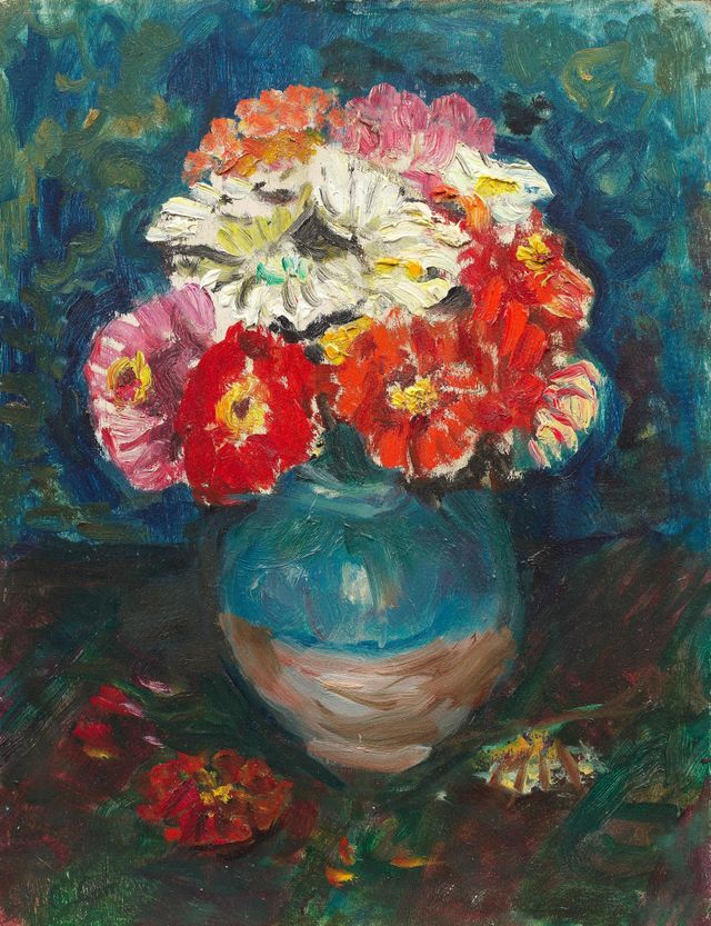 Zinnias dans la cruche verte