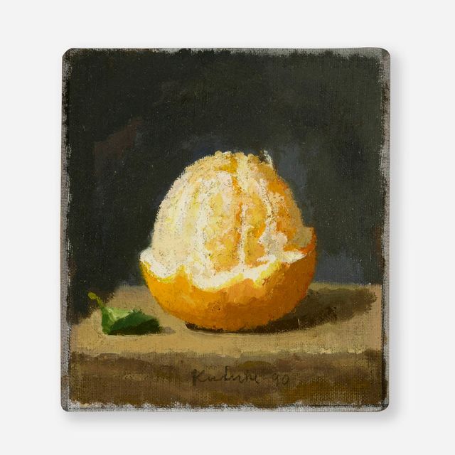 Half-Peeled Orange with a Leaf on a Dark Grey Background