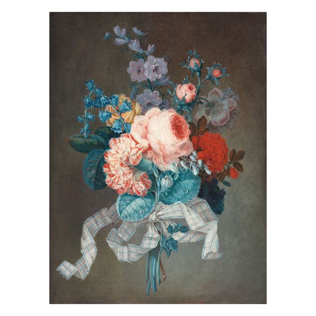 A bouquet of roses, carnations and other flowers tied with a blue and white ribbon